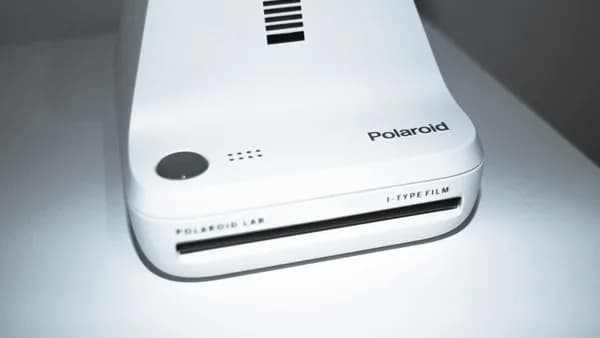 a white electronic device sitting on top of a table