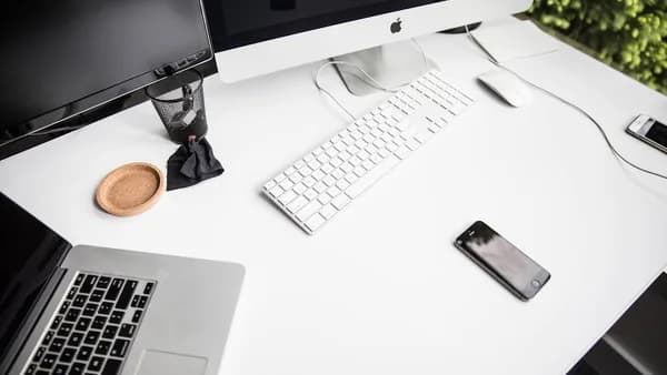 space gray iPhone 6 on table near magic keybord