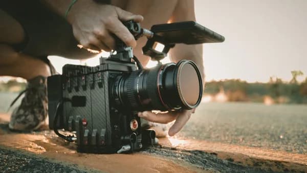 person using professional video camera