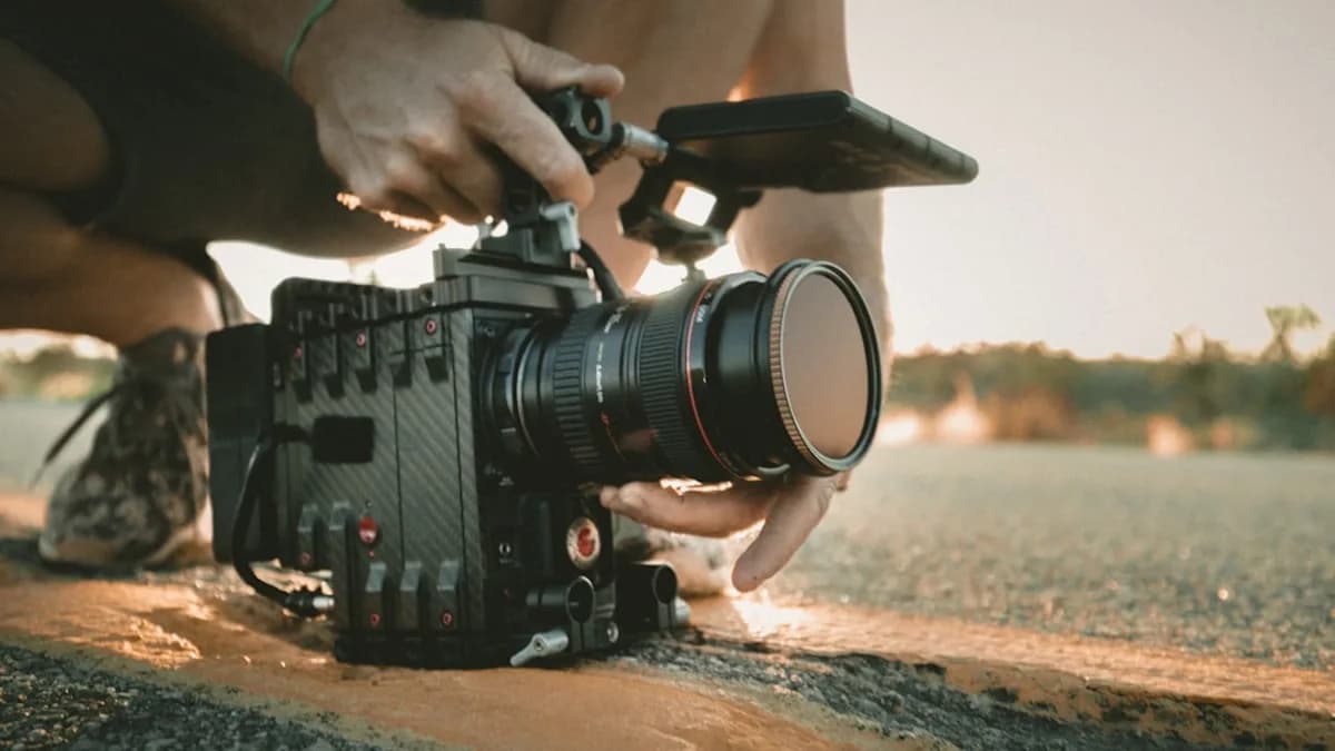 person using professional video camera