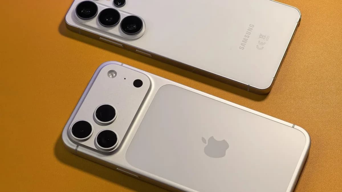 Two white smartphones with multiple cameras