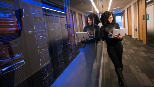 woman in black top using Surface laptop