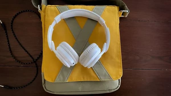 a pair of headphones sitting on top of a bag