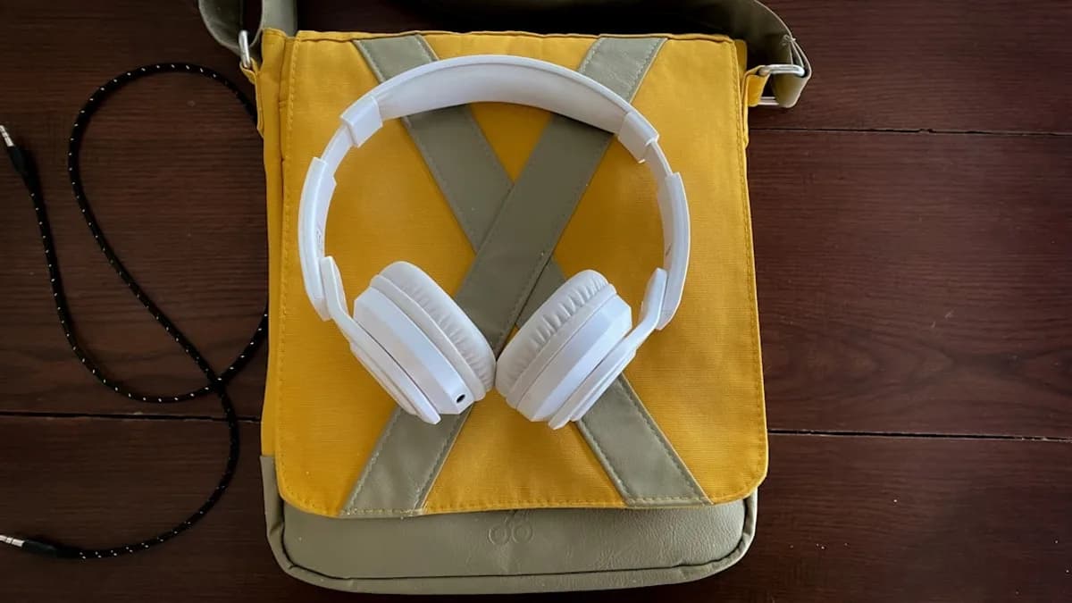 a pair of headphones sitting on top of a bag