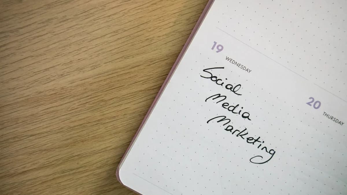 a notepad with the words social media marketing written on it