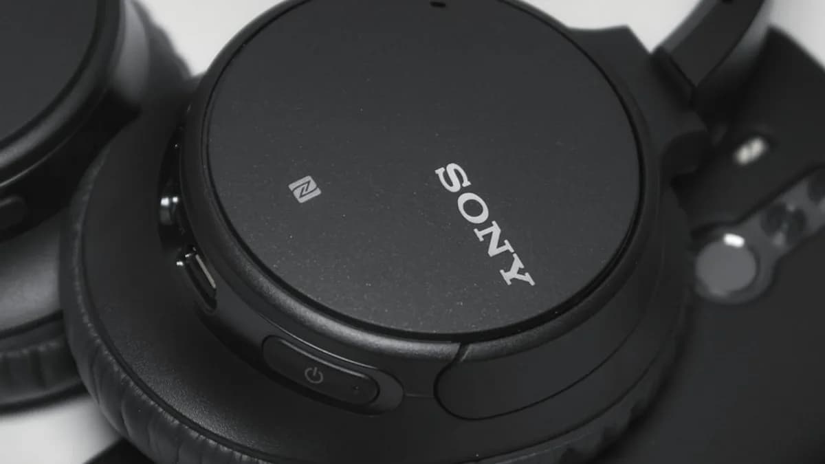 black Sony cordless headphones on white surface