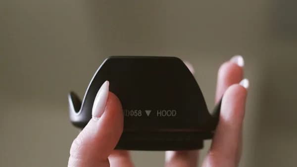 a person holding a cell phone in their hands