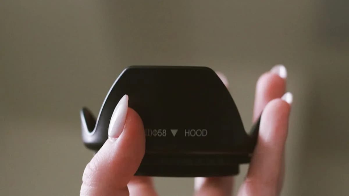 a person holding a cell phone in their hands