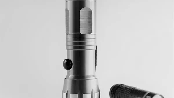 silver and black microphone on white surface
