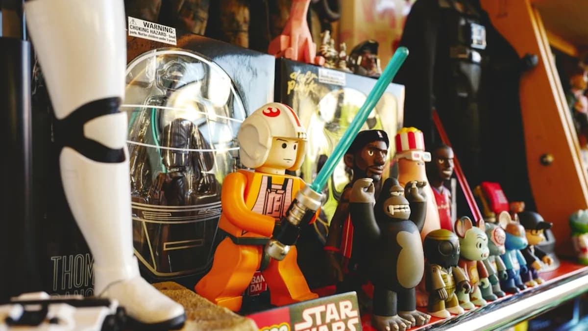 a shelf full of star wars toys and figurines