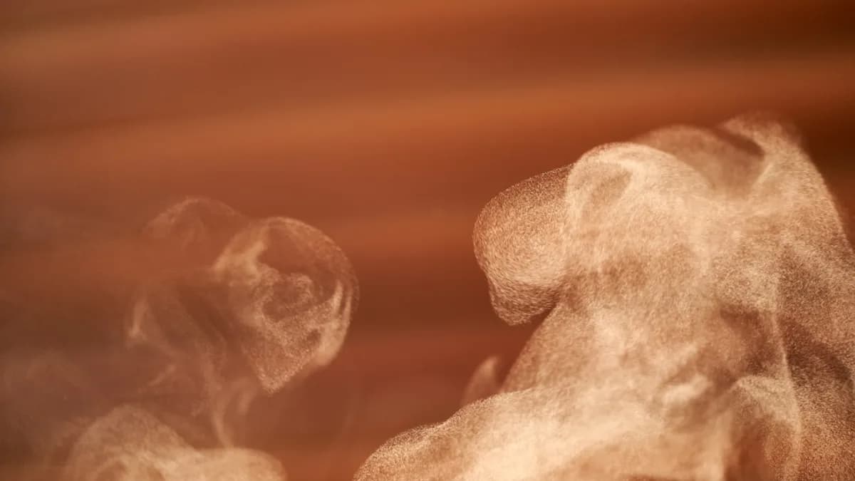 a steaming cup of coffee with steam coming out of it