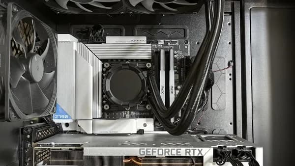 Computer components inside a black case with fans.