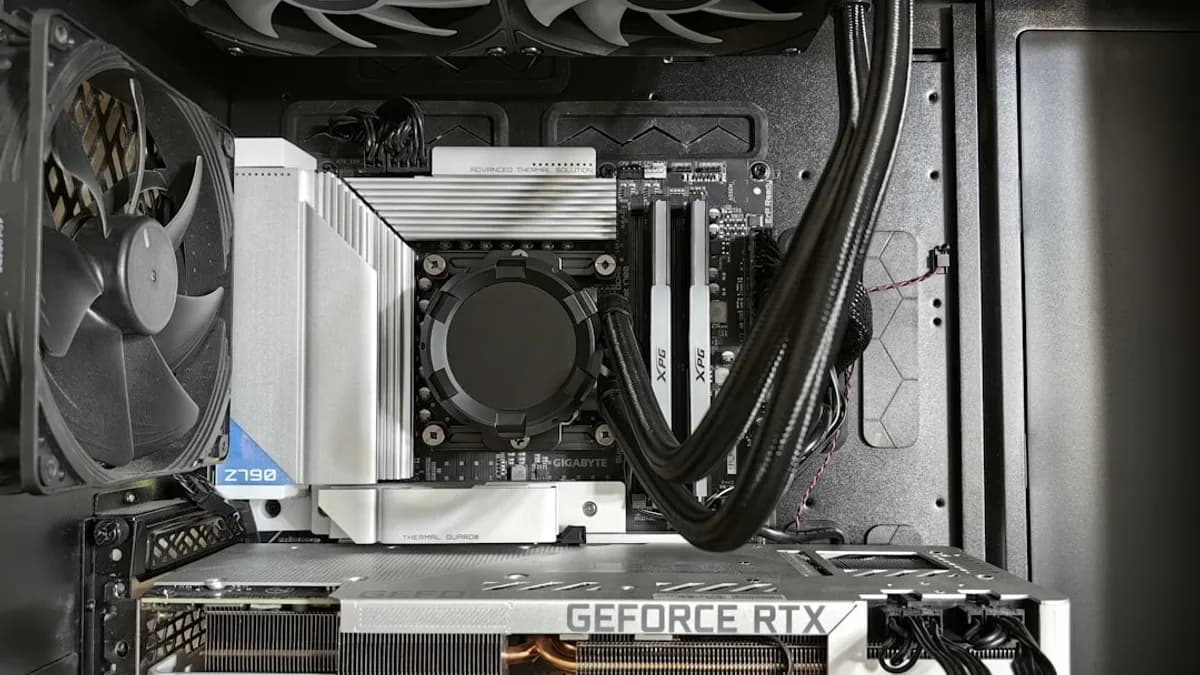 Computer components inside a black case with fans.