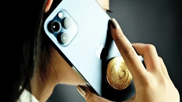 person holding white and black smartphone case