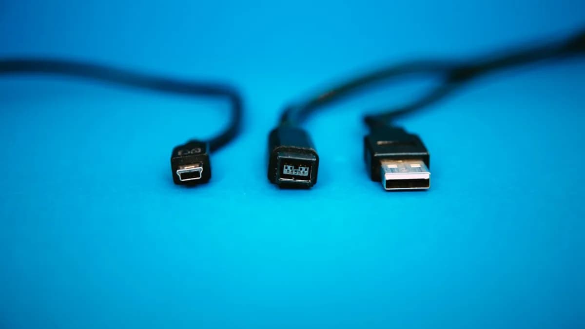 black USB cables on blue surface