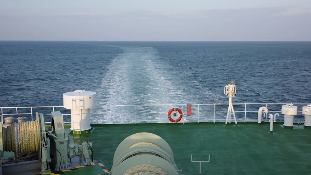 a boat traveling across a large body of water