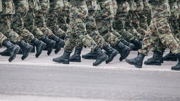 men in green and brown camouflage uniform