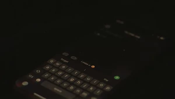 a close up of a cell phone in the dark