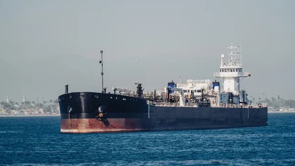 A large cargo ship in the middle of the ocean
