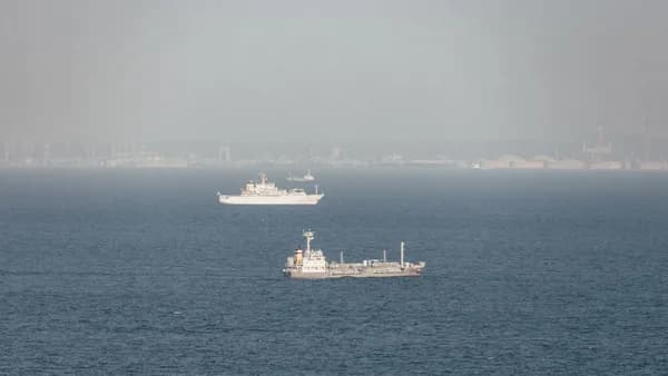 Two ships in the ocean on a foggy day