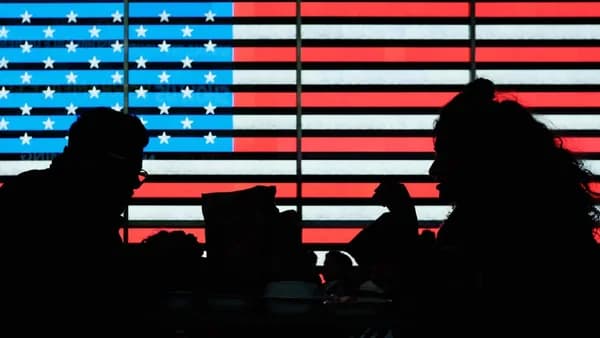 silhouette of people sitting on chair