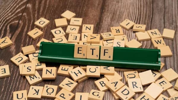 scrabble tiles spelling out letters on a wooden table