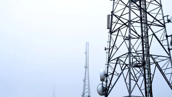 a tower with several cell phones on top of it