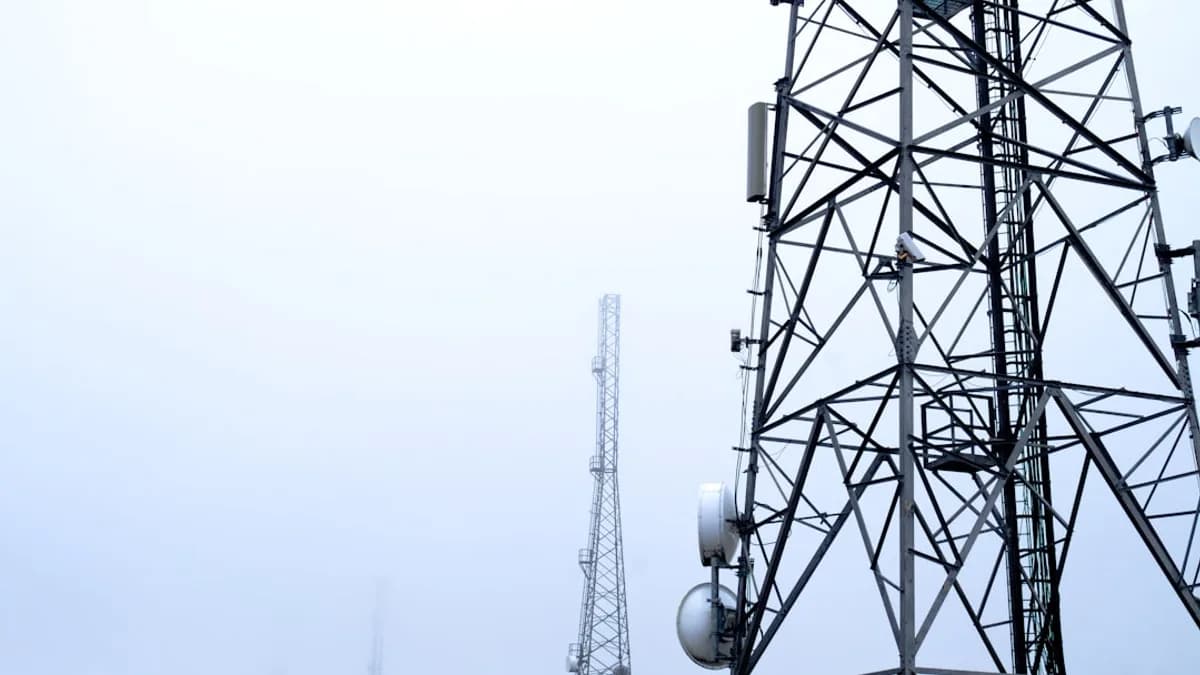 a tower with several cell phones on top of it