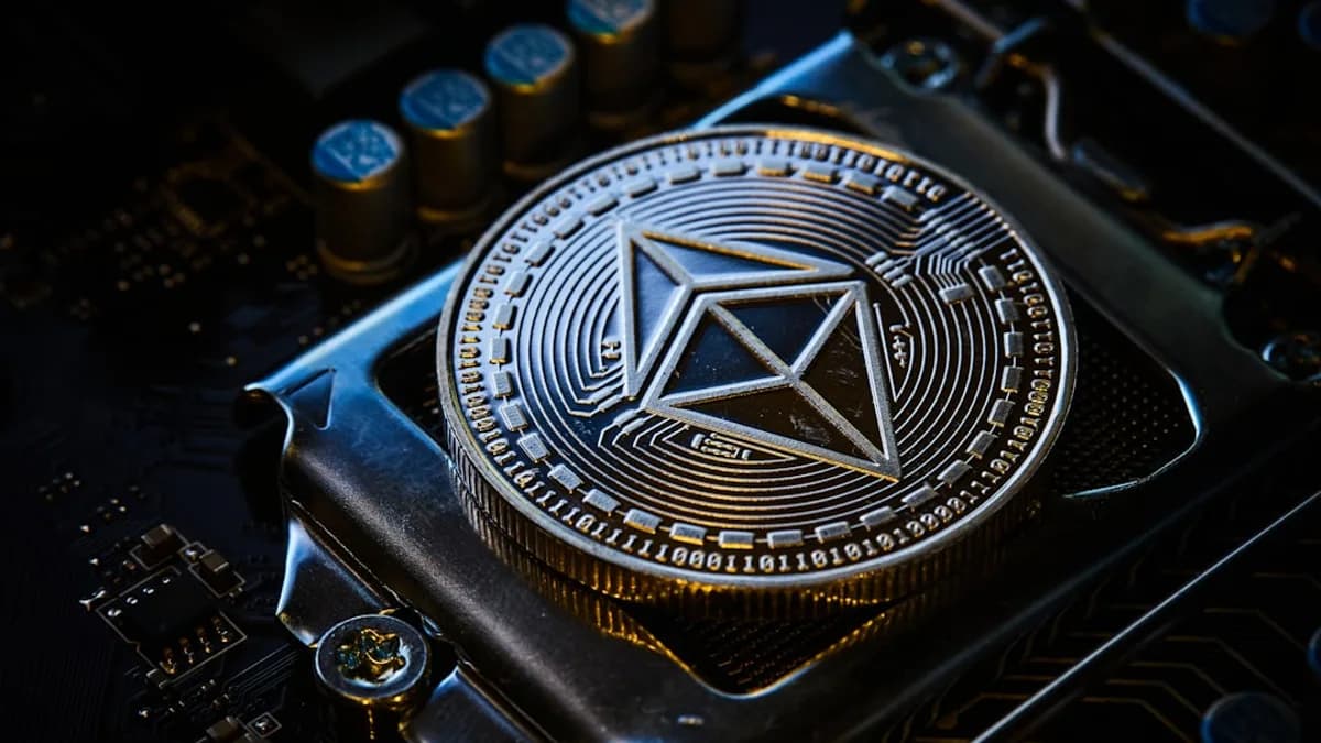 a close up of a computer chip with a symbol on it