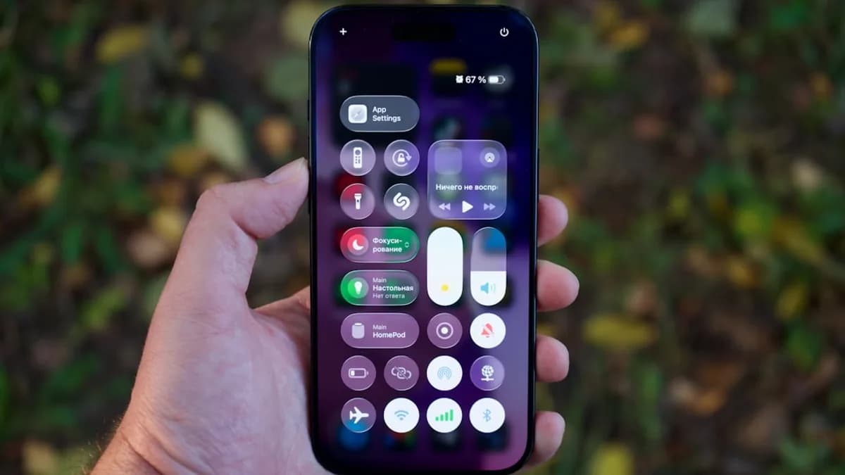 Hand holding a smartphone with colorful app icons.