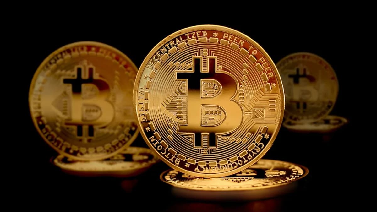 a group of gold bitcoins sitting on top of each other