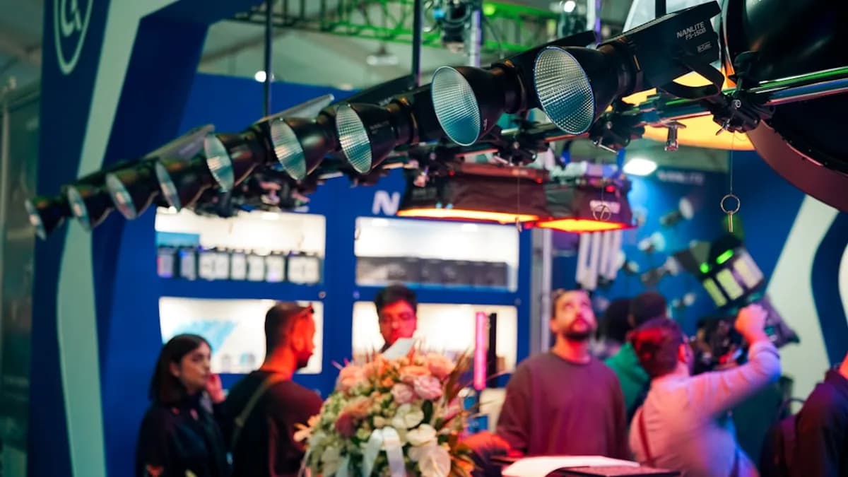 People gather under stage lights at an event