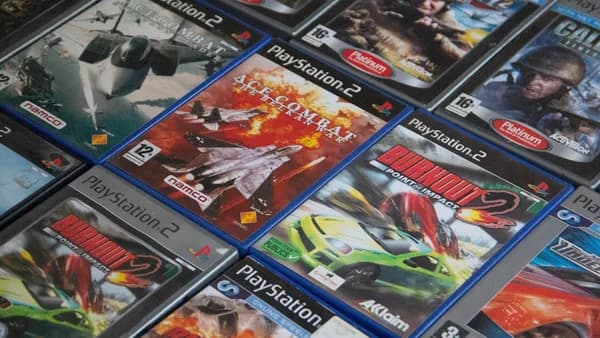 a pile of video games sitting on top of a table