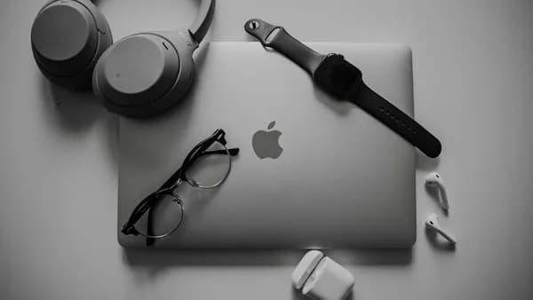 a black and white photo of a microphone and headphones