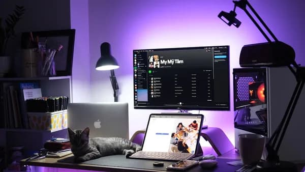 black and silver laptop computer on brown wooden table