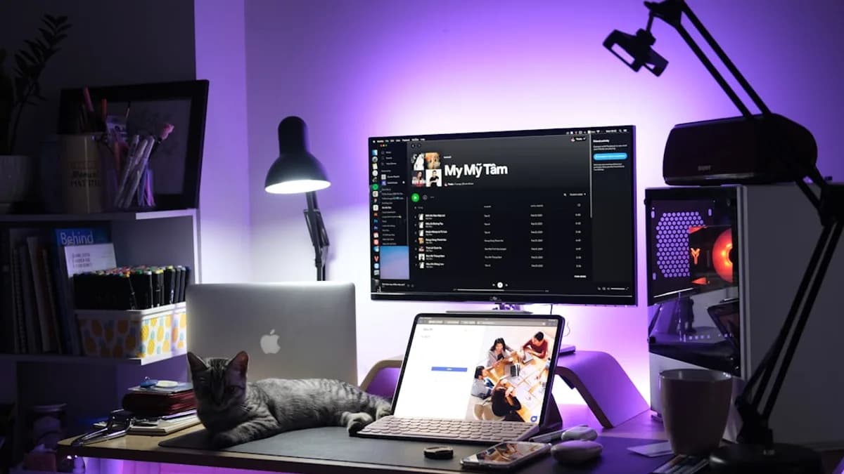 black and silver laptop computer on brown wooden table