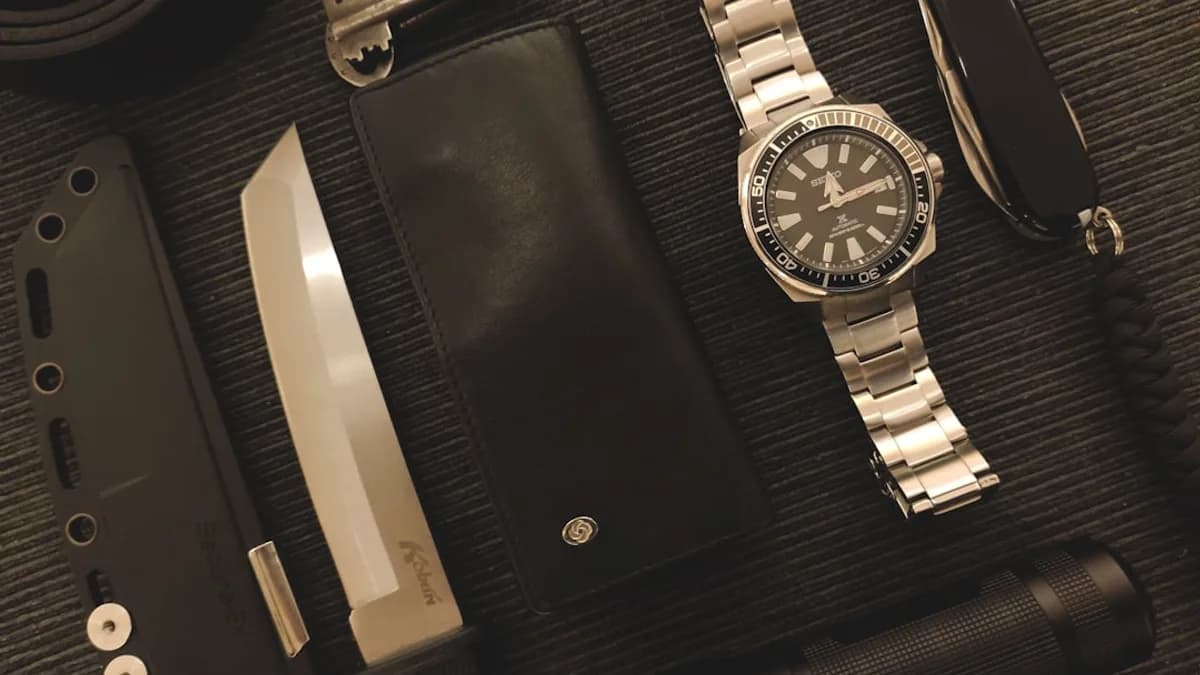 Everyday carry items on a textured surface.