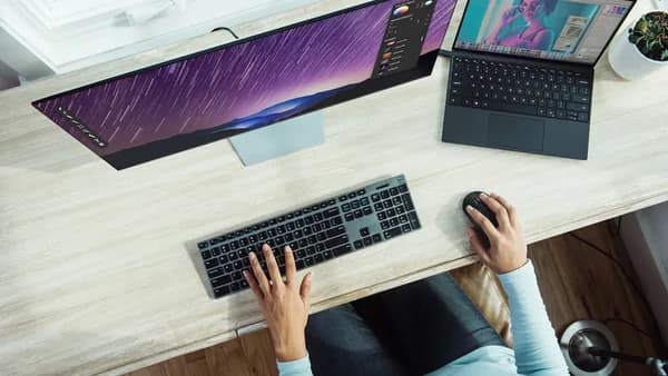 person using laptop on table