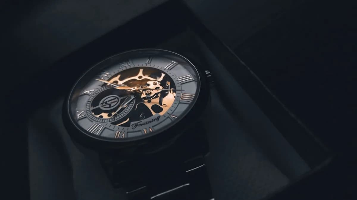 a watch sitting on top of a black box
