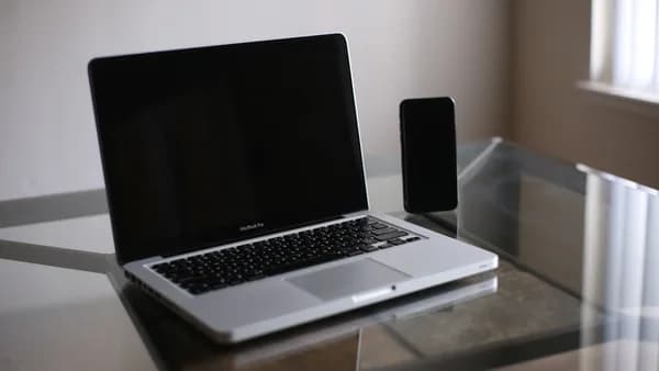 macbook pro on glass table