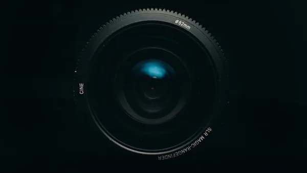 black camera lens on white background