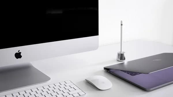 silver iMac, keyboard, and mouse