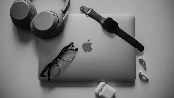 a black and white photo of a microphone and headphones