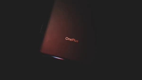 red lenovo laptop computer on white surface