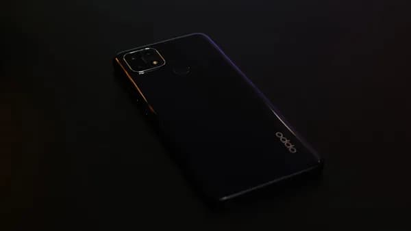 black samsung android smartphone on black surface