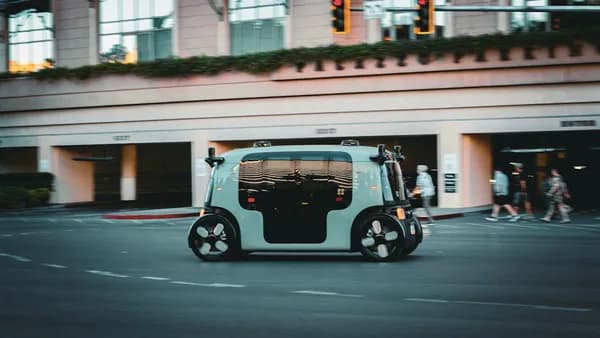Autonomous vehicle driving on a city street.