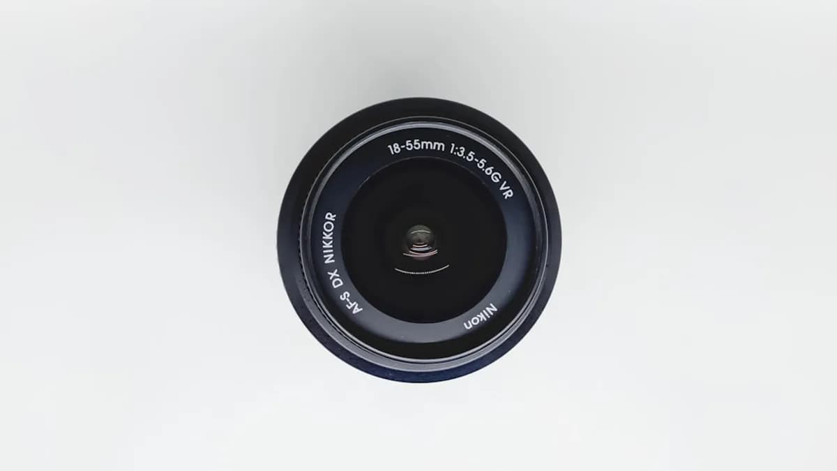 black camera lens on white surface