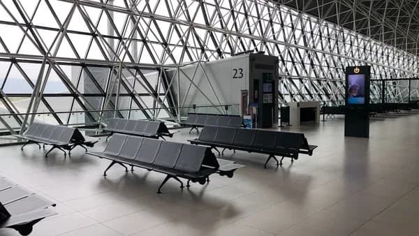 black metal gang chairs on white ceramic flooring