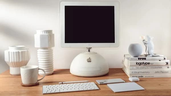 silver imac on brown wooden desk