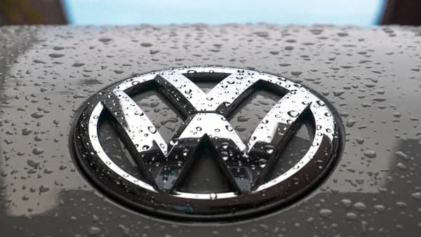 water dew on silver Volkswagen car emblem